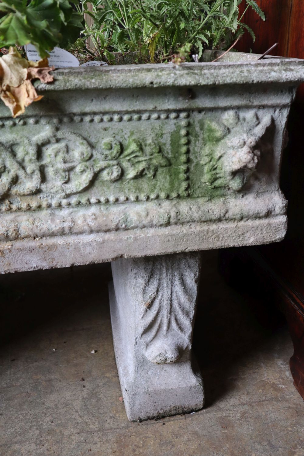 A reconstituted stone rectangular garden planter on trestle stand, length 92cm height 58cm